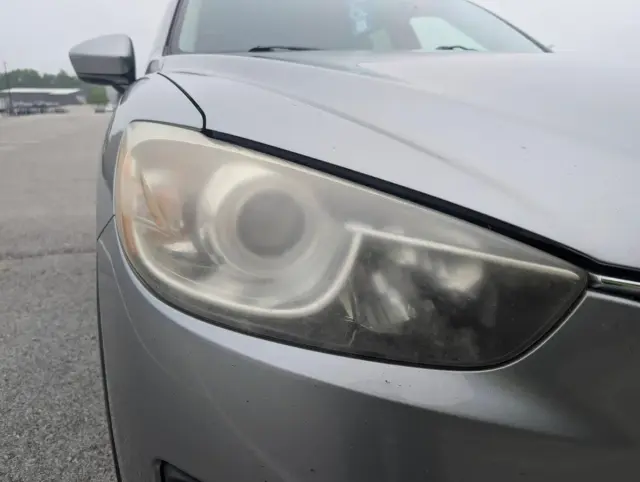 Before headlight restoration — faded headlight lens
